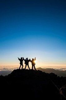 Tourists in backlight waiting for sunset on top of Haleakala National Park