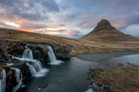 Kirkjufell mountain with Kirkjufellfoss waterfall at sunset