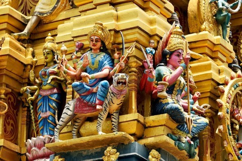 Colorful Hindu temple decorated with figures and gods