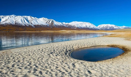 Sandy beach with pool