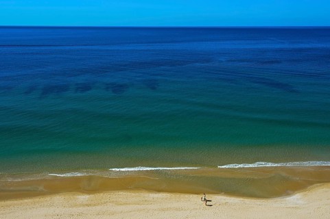 Empty sandy beach on the Algarve coast near Praia da Luz