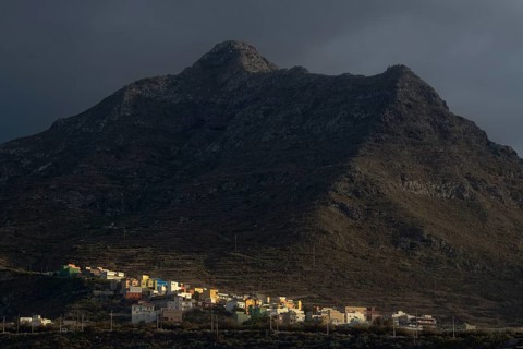 Colorful houses of Punta Hidalgo in front of Anaga Mountains