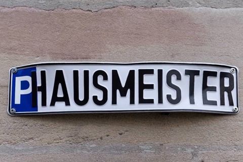 Sign on a house wall