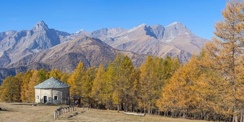 View of Monte Cersogno and Pelvo di Elva in autumn with chapel Chiesa San Giovanni