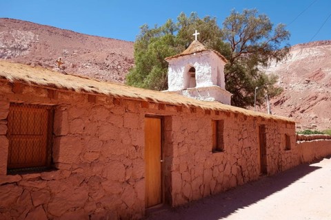 Church in the Adobese style with thatched roof