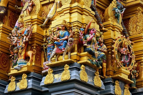 Colorful Hindu temple decorated with figures and gods