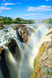 Rainbow over waterfall