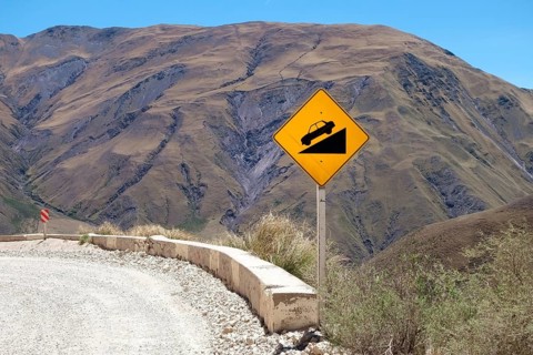 Warning sign on gravel road
