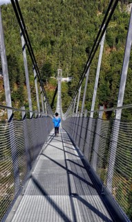 Child on suspension bridge Highline 179
