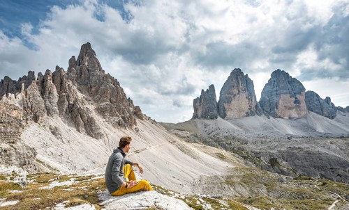 Hiker sits on rock