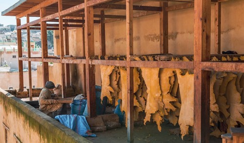 Worker working on leather