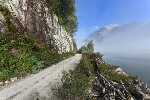 Gravel road with rainbow at Puerto Rio Tranquilo