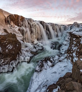Waterfall with ice and snow in winter