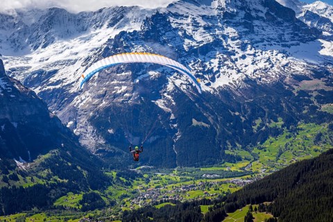 Paraglider after take off from First mountain above Grindelwald
