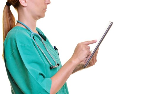 Doctor using a tablet computer
