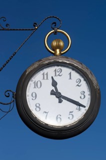 Hanging shop sign as pocket watch at a watch shop