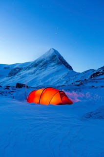 Tent with person in the snow