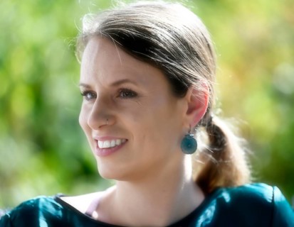 Young woman smiles