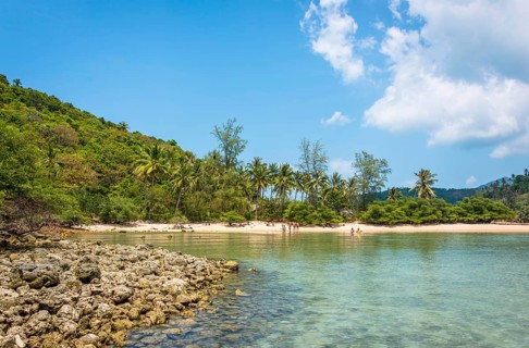 View from Mae Haad Beach to idyllic bay with white sandy beach of the island Ko Ma
