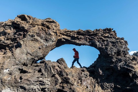 Man in a rock arch