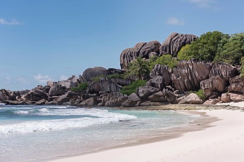 Grand Anse sandy beach with black granite rocks