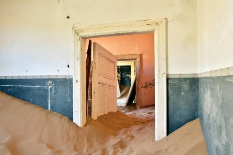 Desert sand in the ruined building of the former diamond city