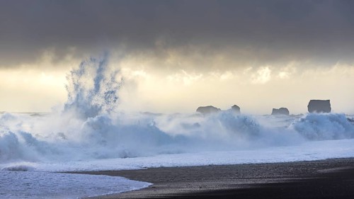 Storm waves at Reynisfjara Black Sand Beach and Cape Dyrholey