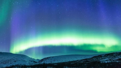 Northern Lights (Aurora borealis) over mountains