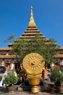 Wheel of Life in front of a nine-story Stupa Phra Mahathat Kaen Kakhon