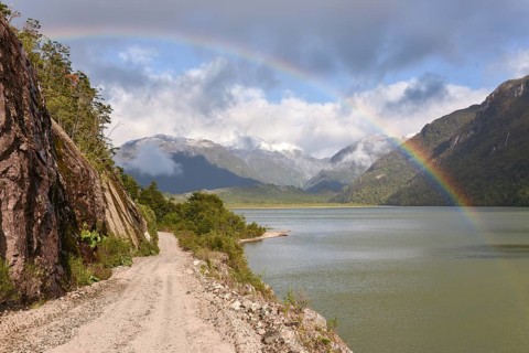 Gravel road with rainbow at Puerto Rio Tranquilo