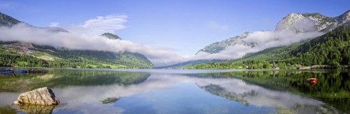 Panoramic view over the Grundlsee with low clouds