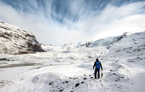 Hiker with ice pick on the glacier