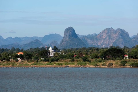 View over the border river Mekong to karst mountains in Laos