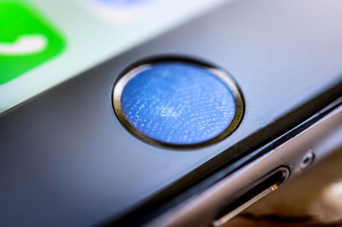 Close-up of Home button of the iPhone 6s with fingerprint on fingerprint sensor