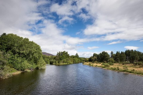 The River Spey flows and flows through the Loch Insh