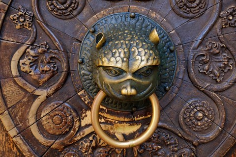 Lowenkopf as door knocker at the south portal