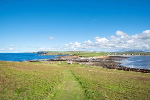 View from the tidal island Brough of Birsay to the island Orkney-Mainland