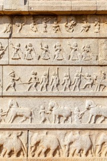 Outer walls of the Hazara Rama temple show Hindu festive procession