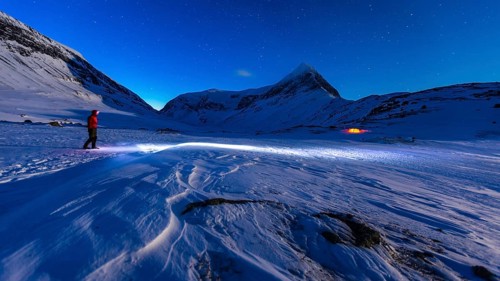 Person with a tent in the snow