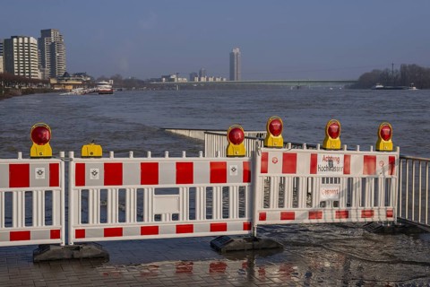 Barrier at a ship landing stage on the Rhine during flood