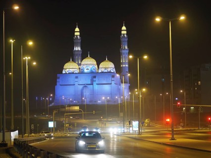 Traffic in front of illuminated Mohammed Al Ameen Mosque