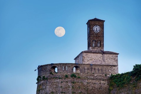 Clock tower on the castle at full moon