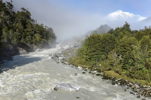 Rio Norte or Rio Exploradores in the fog with glacier San Valentin