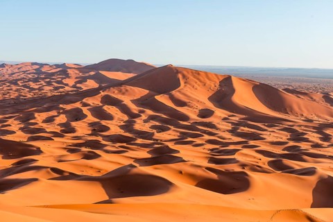 Red sand dunes in the desert