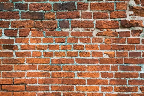 Close-up of red brick wall