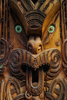 Traditional wood carved mask in the Te Puia Maori Cultural Center
