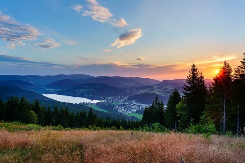 View from Hochfirst to Lake Titisee and Feldberg mountain at sunset