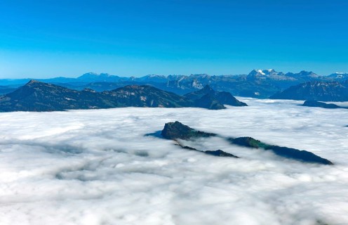 The Burgenstock rises from the sea of fog over Lake Lucerne
