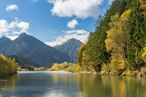 The river Lech with autumnal forest near the Ziegelwiesen