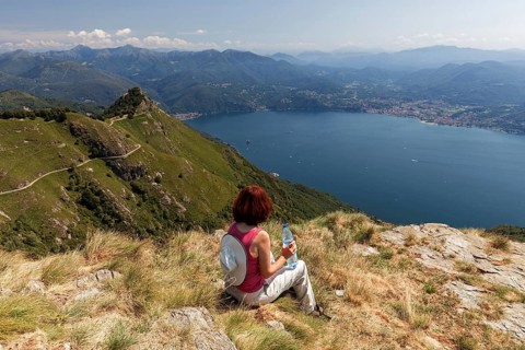 Hiker looks out from Morissolino to Lago Maggiore